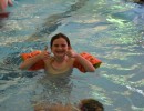 Girl putting thumbs up in swimming pool