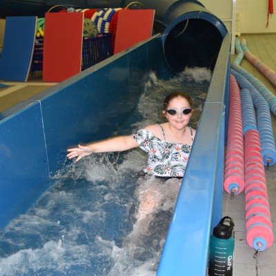 Girl coming down water flume